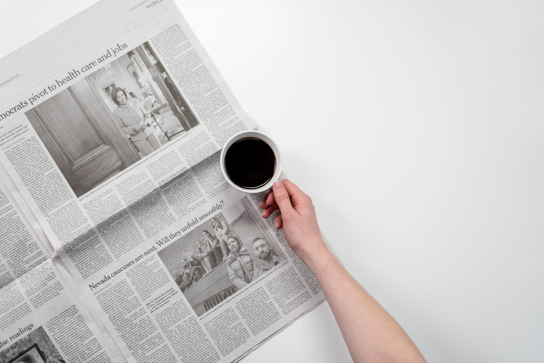 Hand holding a black coffee over newspaper, perfect for business and morning themes. — erotica photography - Refined Artistic